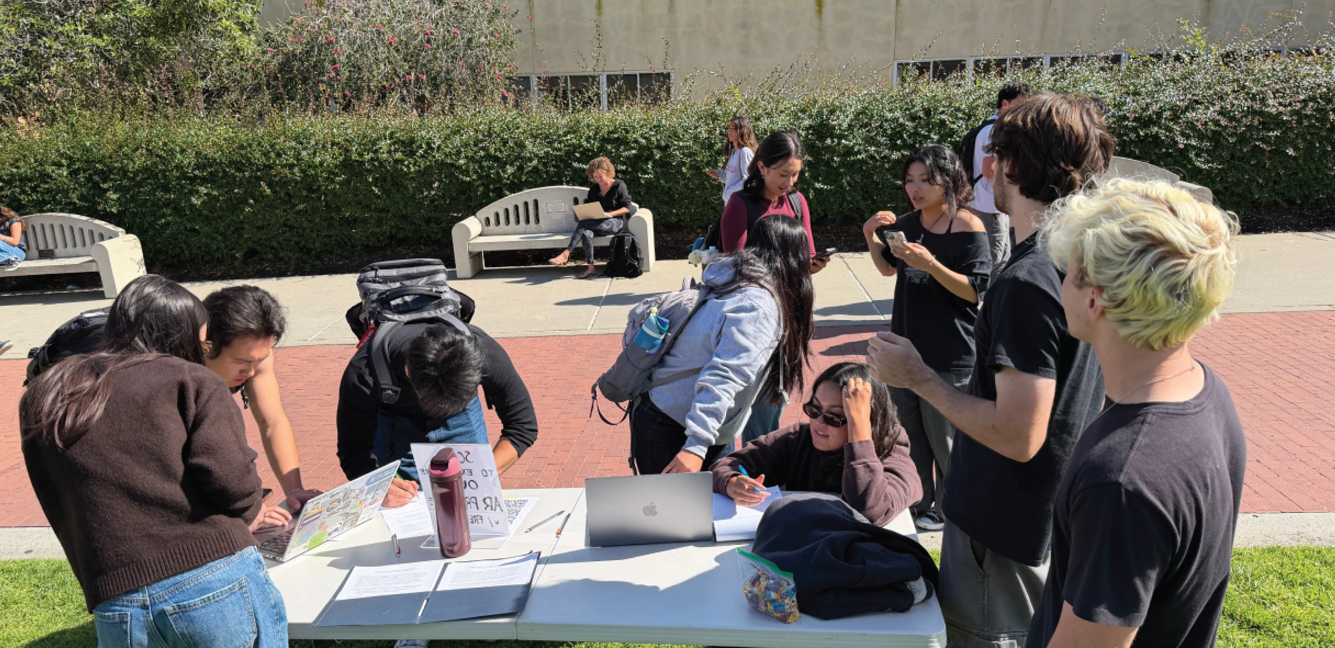 A photo of the team on a lawn collecting user testing data.